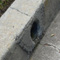 Cracked Curb Drain